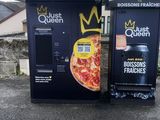 two vending machines on the side of the road