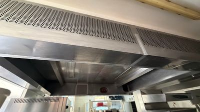 an image of a commercial kitchen with stainless steel appliances