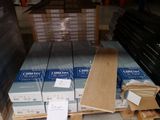 a lot of boxes of wood on a pallet in a warehouse