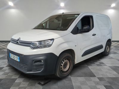 the white van is parked on a checkered floor in a room