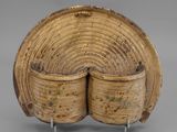 a wooden bowl with two sections of wood in the middle