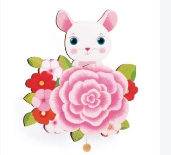 une image représentant une poupée en papier en forme de lapin avec des fleurs