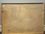 an empty wooden box sitting on a carpeted floor next to a wall