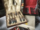 a box with spoons and spoons in it on a table