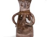 a brown vase with a bird in it on a white background