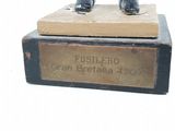 a statue of a man riding a horse on top of a box