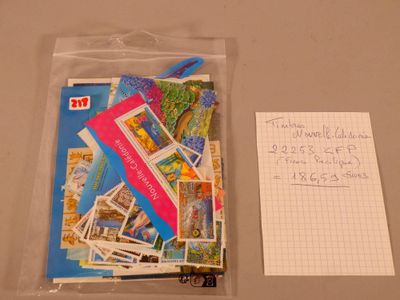 a bag of postcards and a piece of paper on a table