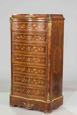 an antique wooden chest of drawers with ornate carvings on the drawers