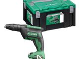 a green corded drill and a tool box on a white background