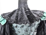 an image of a black and green corset dress on a mannequin