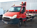 a red truck that is parked in front of a building