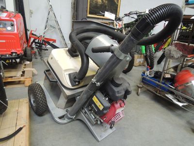 a machine that is sitting on the ground in a garage