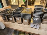 many trays of food that are on a table