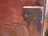 a close up of a wooden door with a lock on it