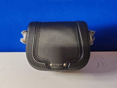 a small black leather purse with a metal handle