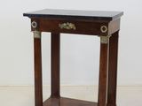 an image of a small wooden table with a black top