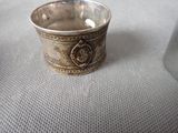 a silver cup sitting on top of a table