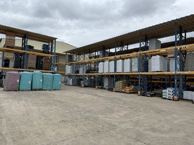 a large warehouse with a lot of shelves and pallets