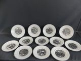six white and black plates with black and white designs on them
