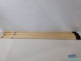 un lot de quatre baguettes posées sur un drap blanc