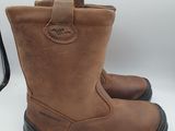 the brown boots are lined up and ready to be worn