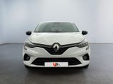 the front view of a white car in a white room