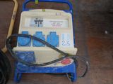 an image of a blue and white machine on a wooden floor