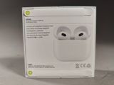 a box with a pair of airpods inside of it