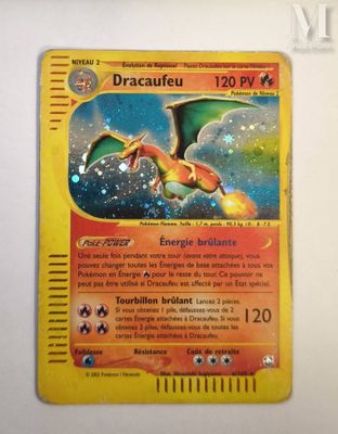 a yellow card with a picture of a dragon on it