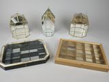 four pieces of glass and metal items on a white surface