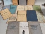 a lot of old books on a white table