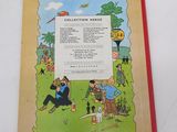 an old children ' s book with a picture of a man and a woman sitting on a bench