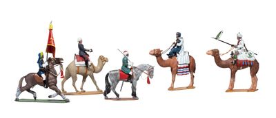 five figurines of men riding on horses and camels