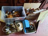 two bins filled with assorted items sitting on the floor