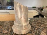 a marble block on the counter in the kitchen