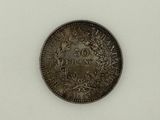 a close up of a coin on a white surface
