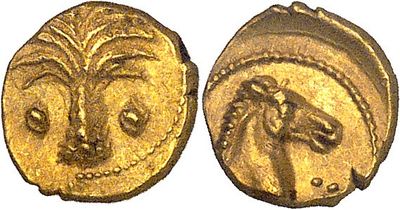 a gold coin with an image of a woman ' s face on it