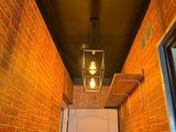 a light that is on above a door in a hallway