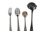 four different types of spoons, forks, and spoon rest on a white surface