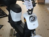a motor scooter that is parked in a store