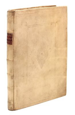 an old book sitting on top of a white surface