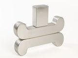 a metal object that is sitting on a white surface