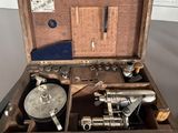 a wooden box with a sewing machine inside of it