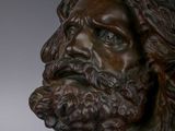 a close up of a statue of a man with a beard