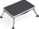 a close up of a foot stool on a white surface