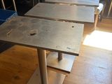 three tables that are sitting in a room