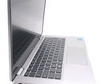 a laptop computer that is open on a white surface