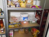 a pantry with shelves full of food and condiments