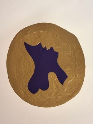 a cookie that has a purple horse on it