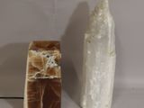 two different types of rocks on a white surface
